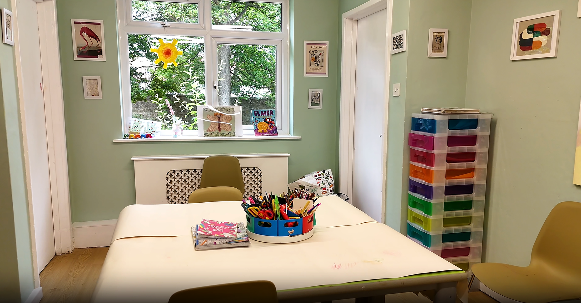 Art room with tables and arts and crafts set up