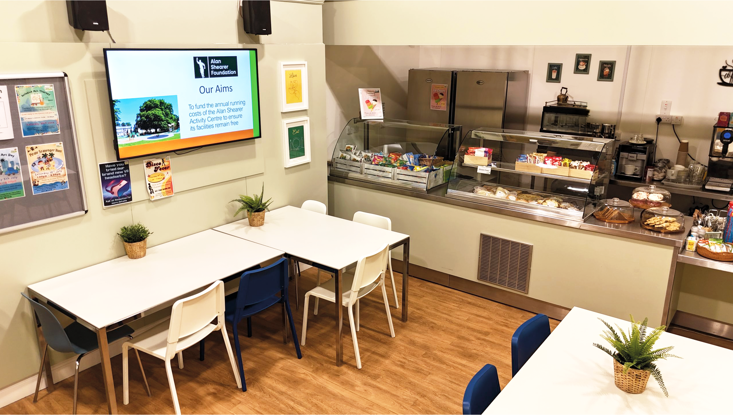 Cafe with tables and chairs and food serving counter