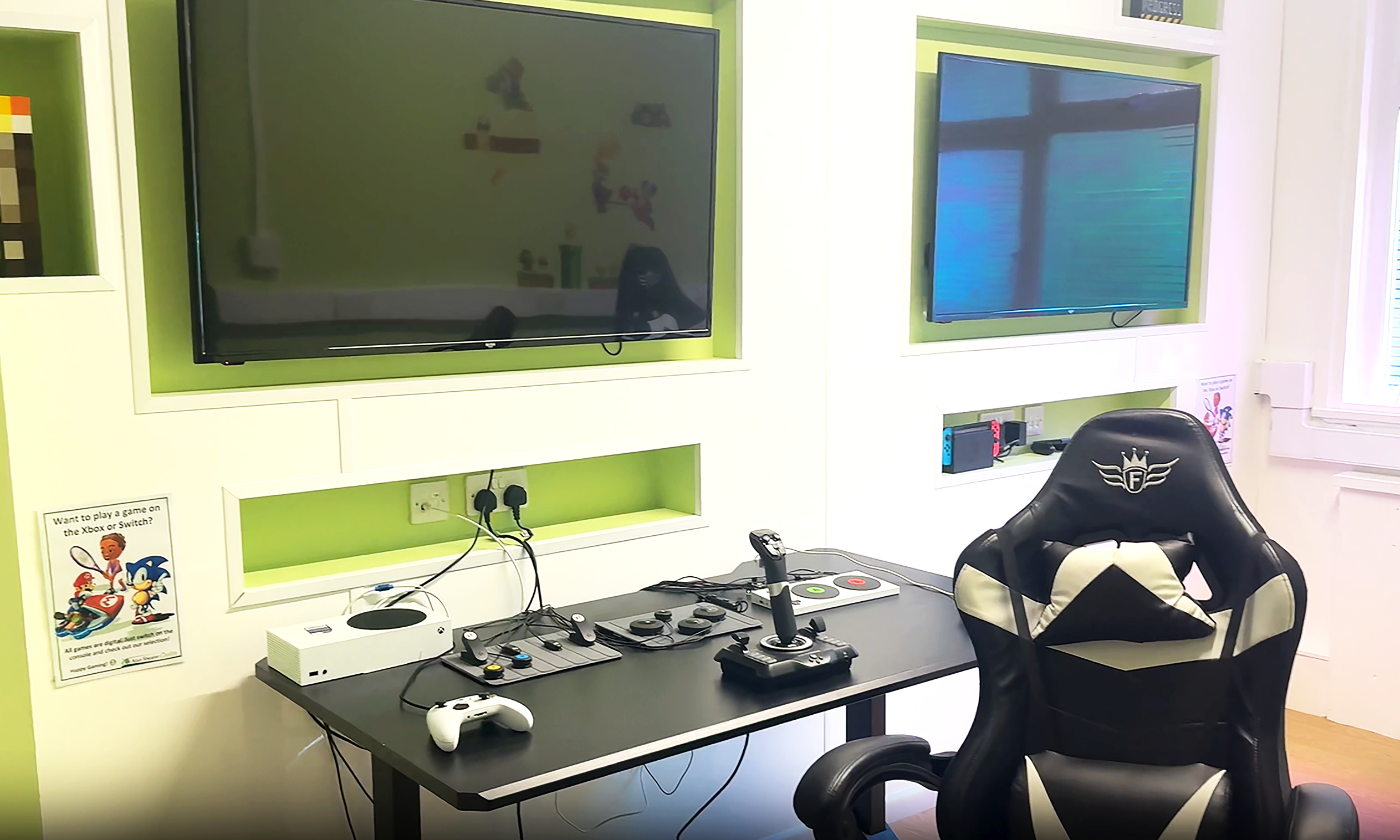 Games room with a tv and play station and gaming controllers