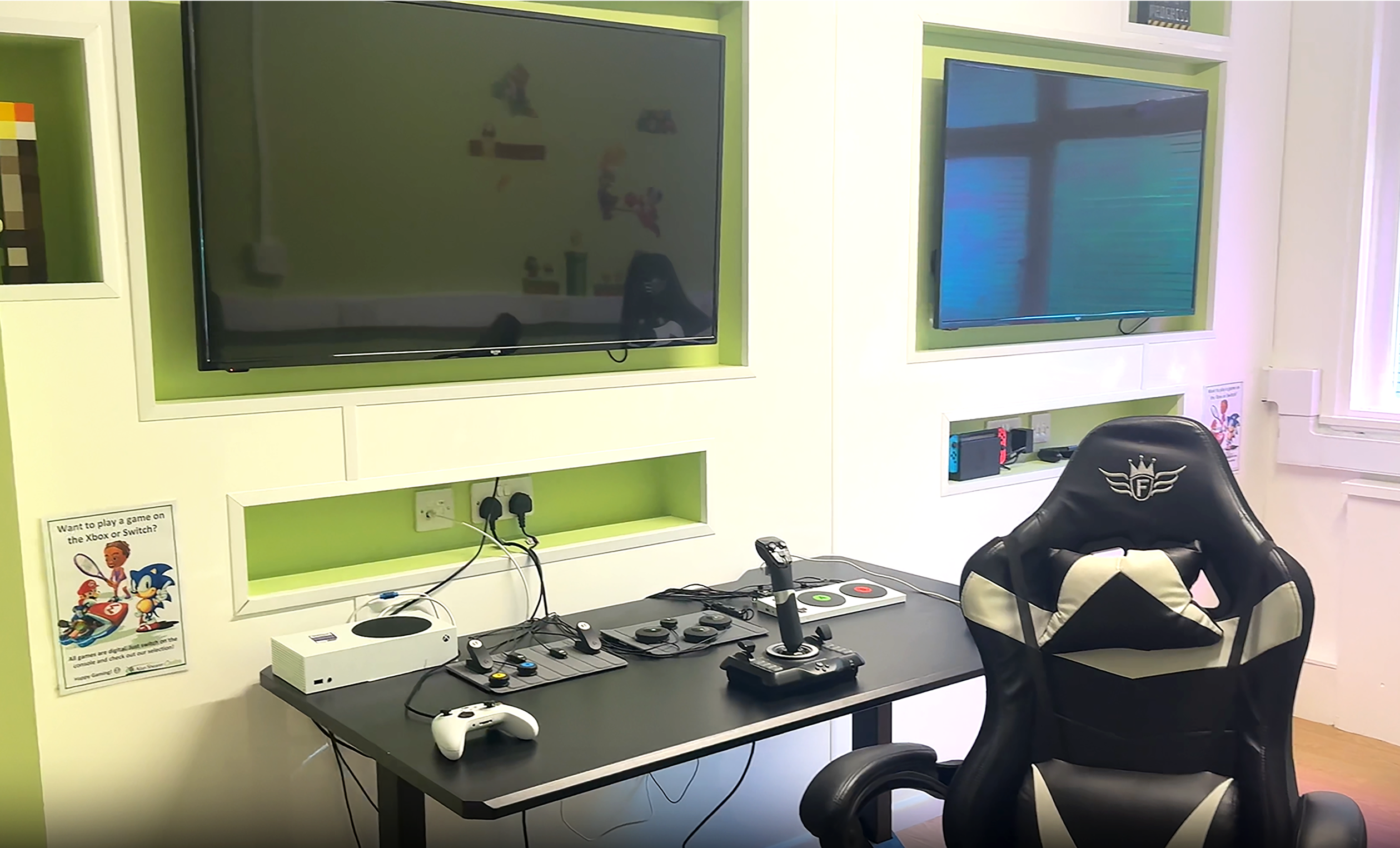 Gaming room with large tv and games equipment