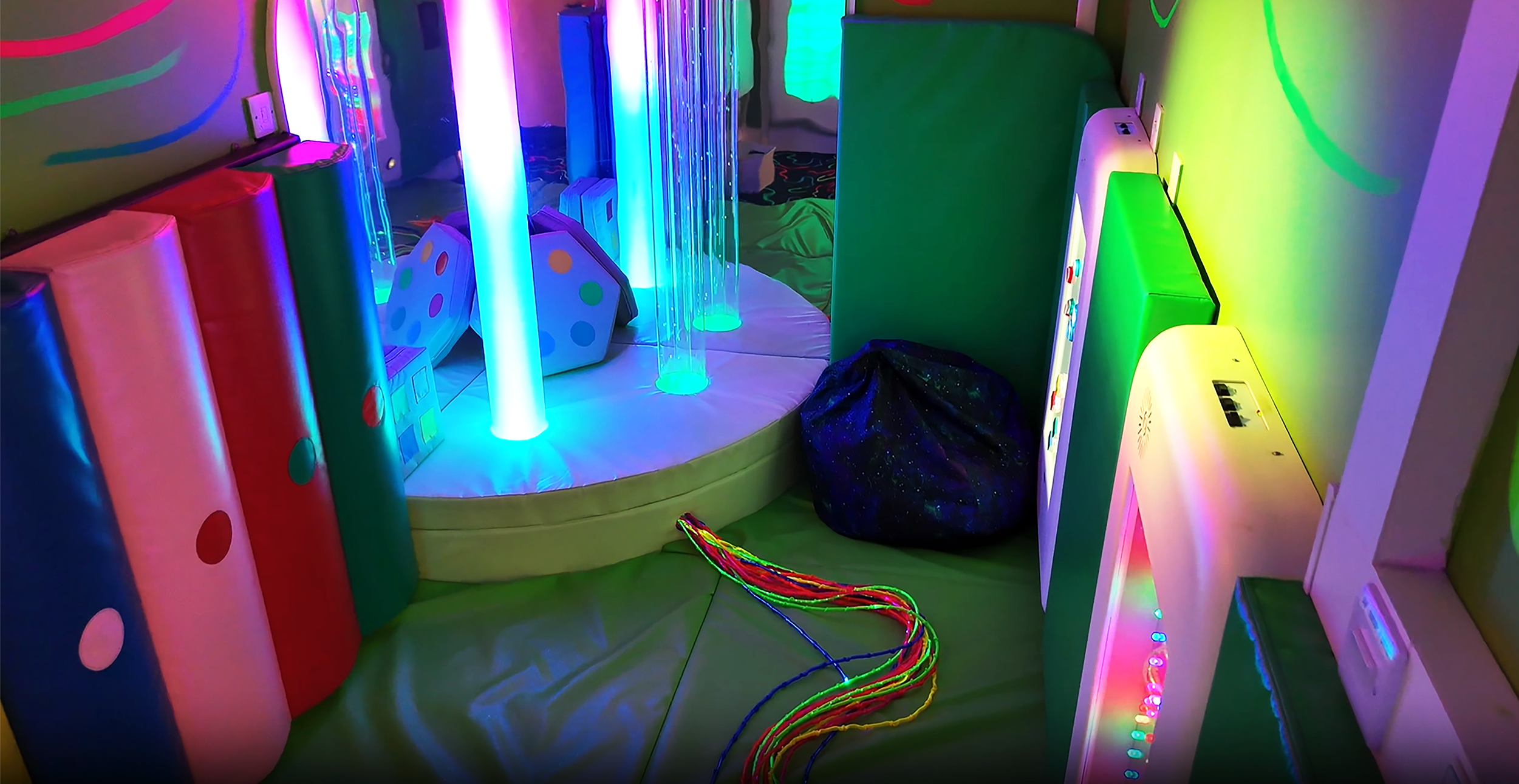 Room filled with bright lights and musical equipment on the walls