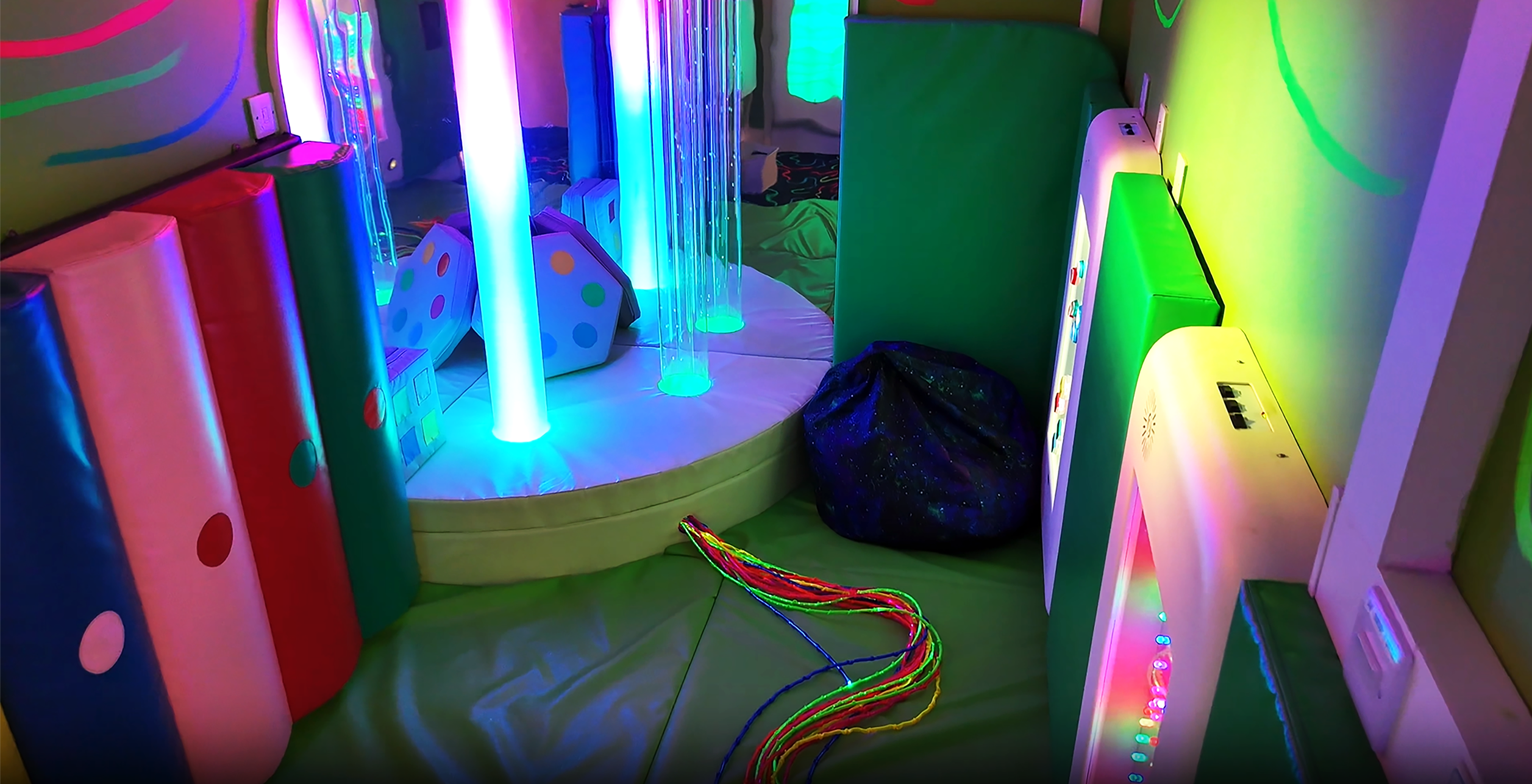 Room with padded walls and floor with bright lights