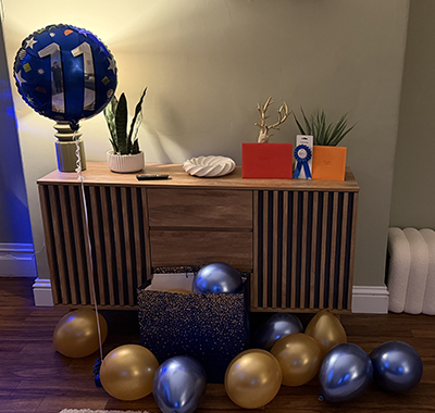Balloons and gifts on display for Ed's birthday celebrations