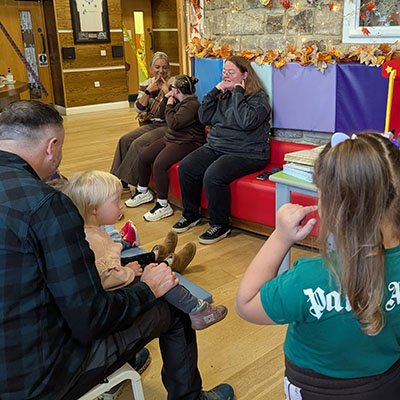A group of people signing together at the Alan Shearer Activity Centre